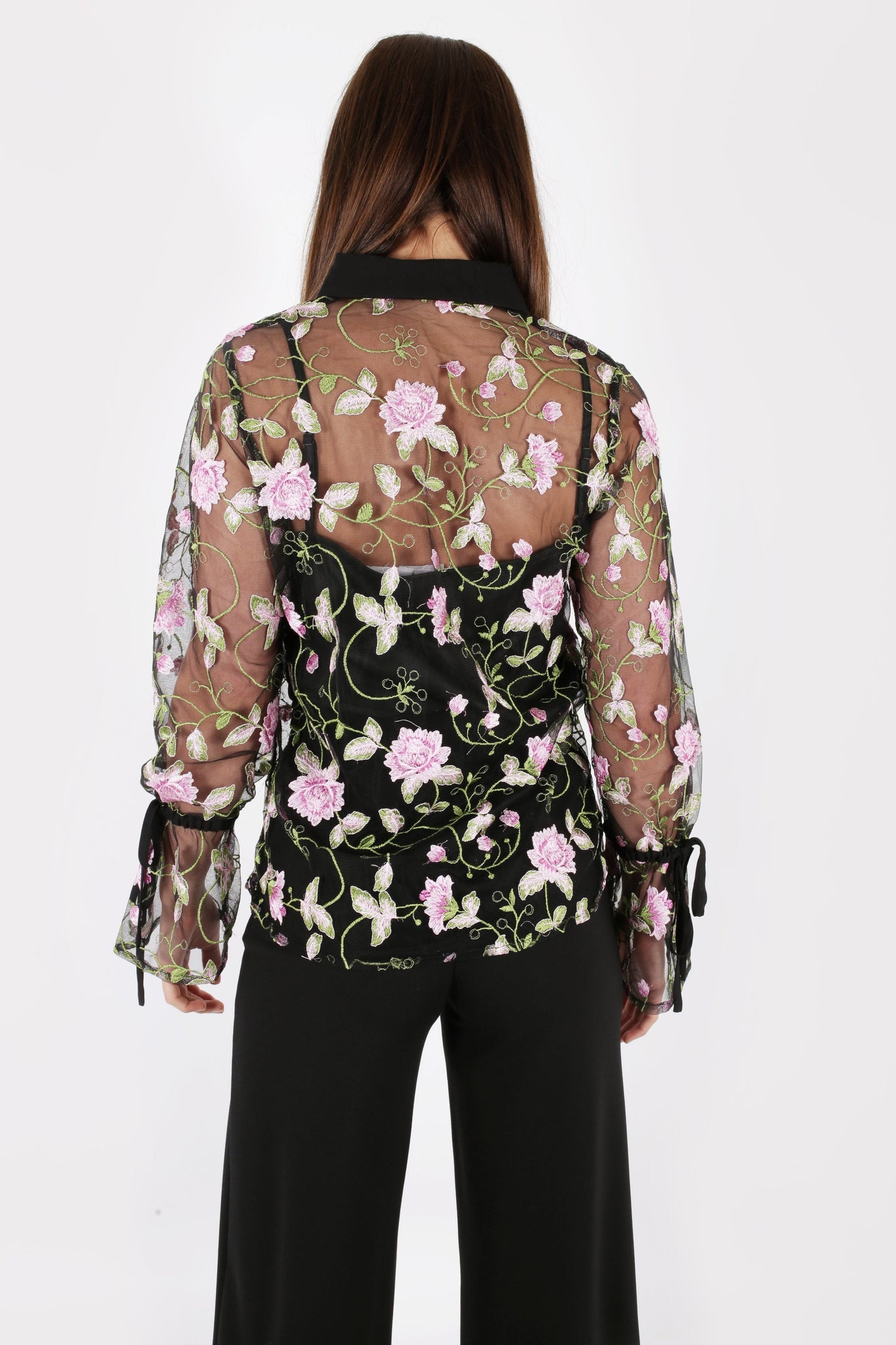 Model Against Plain Background Wearing Black Floral Mesh Top Back Image