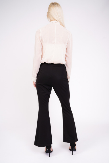 black high waisted trousers behind view